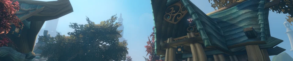 Zephras Islen sinivihreitä haltiarakennuksia ja puiden reunustama kivitie Blizzardin esittelykuvassa.